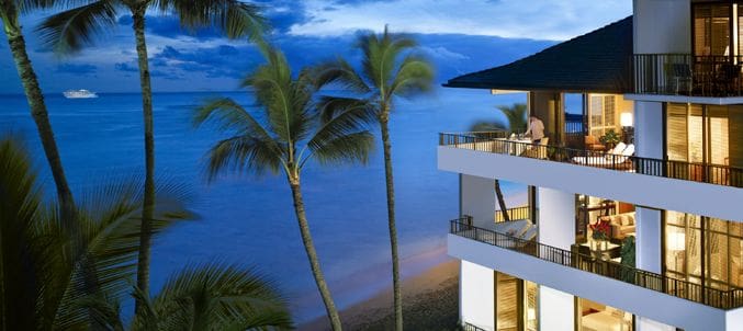 A large cruise ship sailing in the ocean.